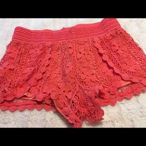 Orange shorts size large, almost famous